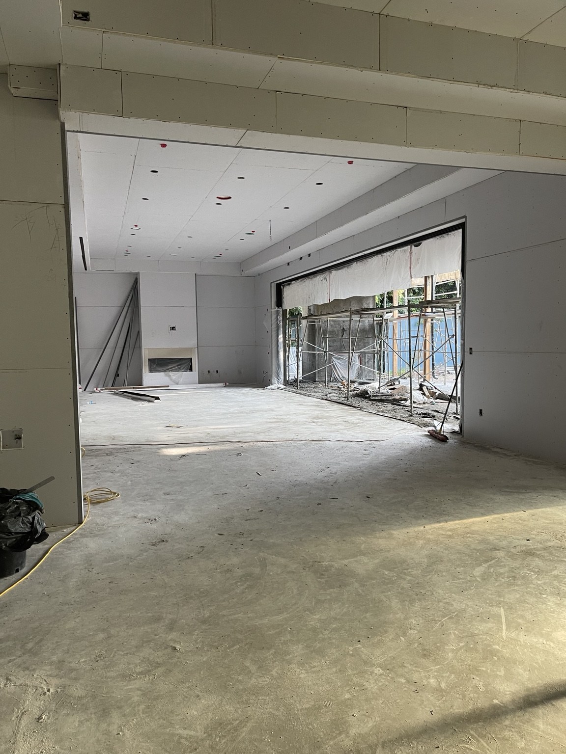 Interior construction with the large garden-facing opening