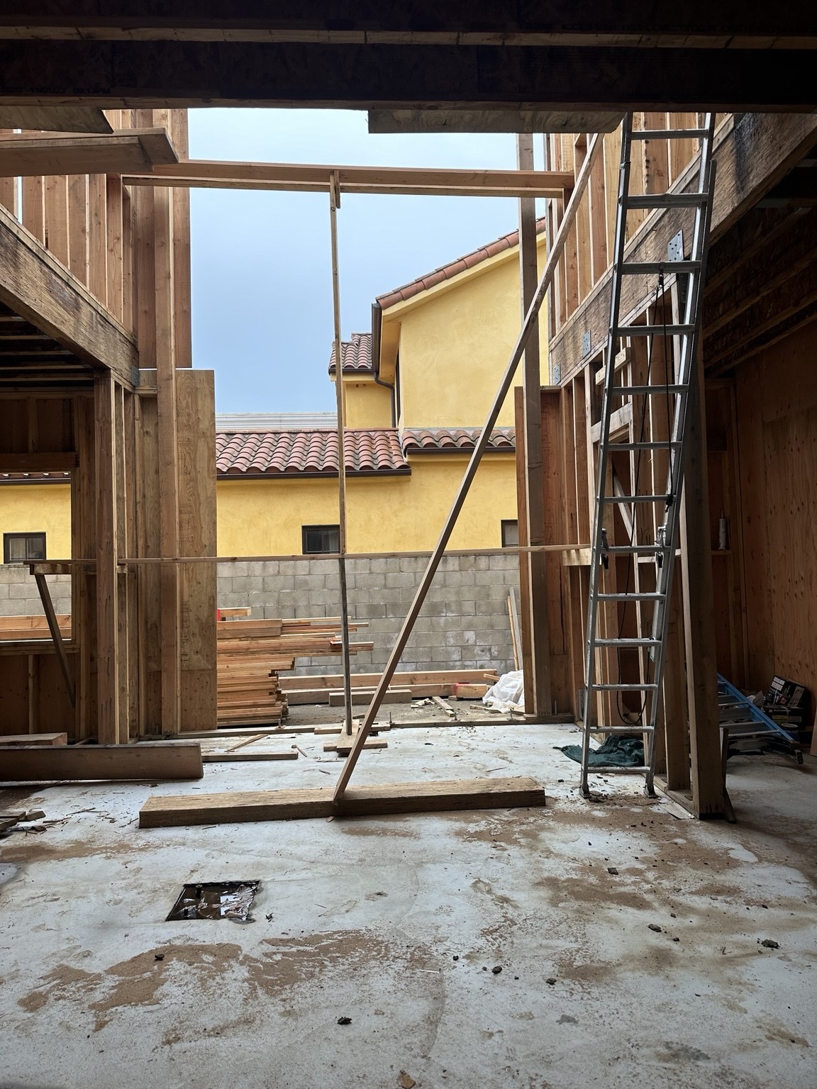 Double-height entry framing before finishes
