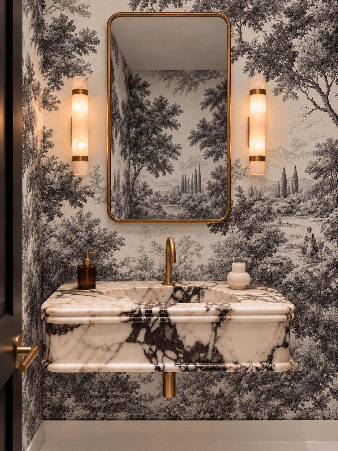 Powder room vanity with brass mirror and paired sconces