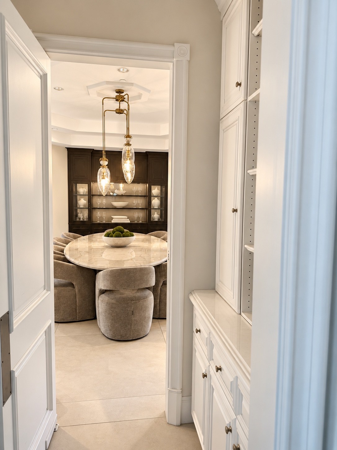 Cabinet-lined passage leading to the dining room