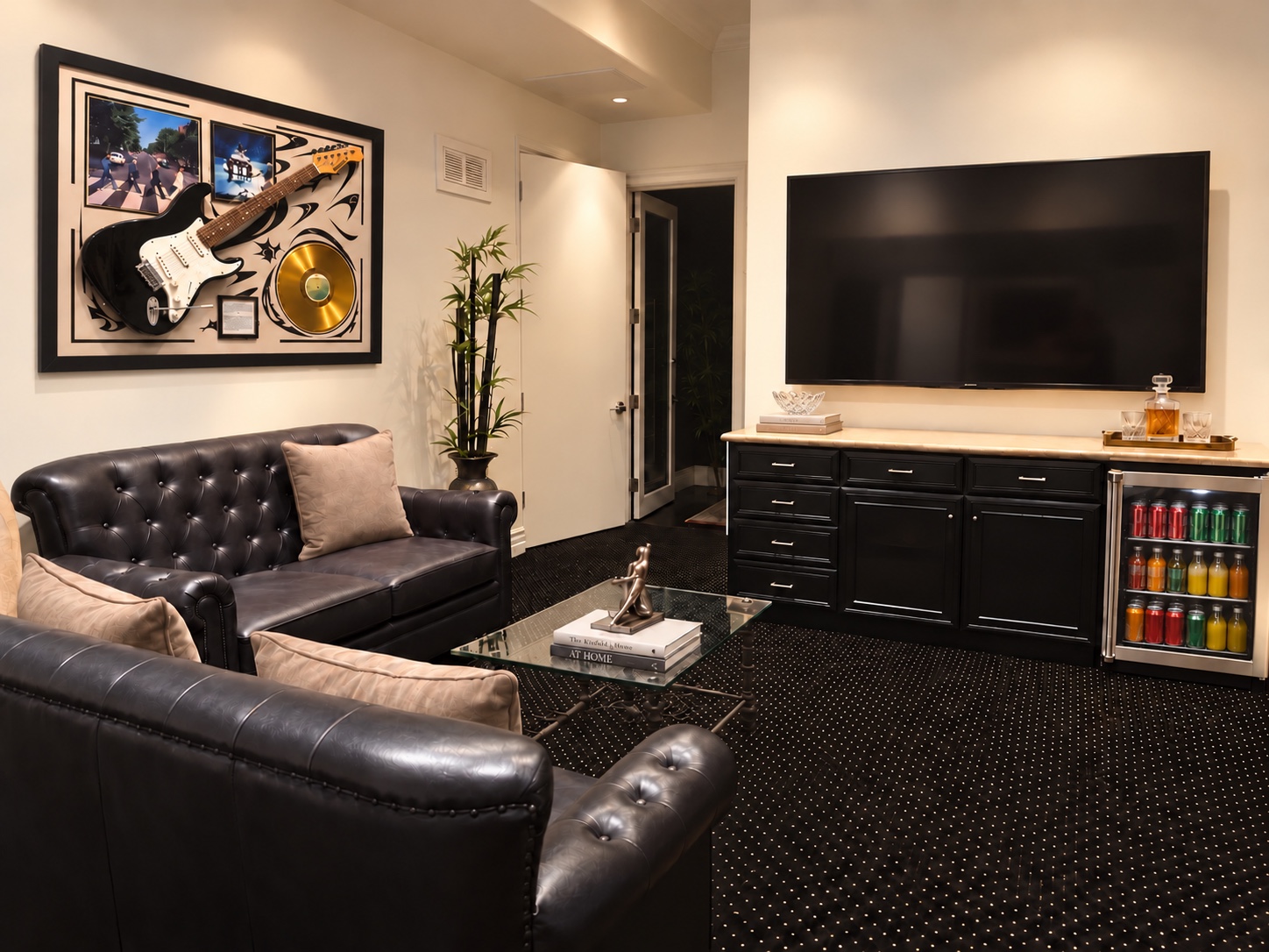 Basement TV lounge with leather seating and music memorabilia