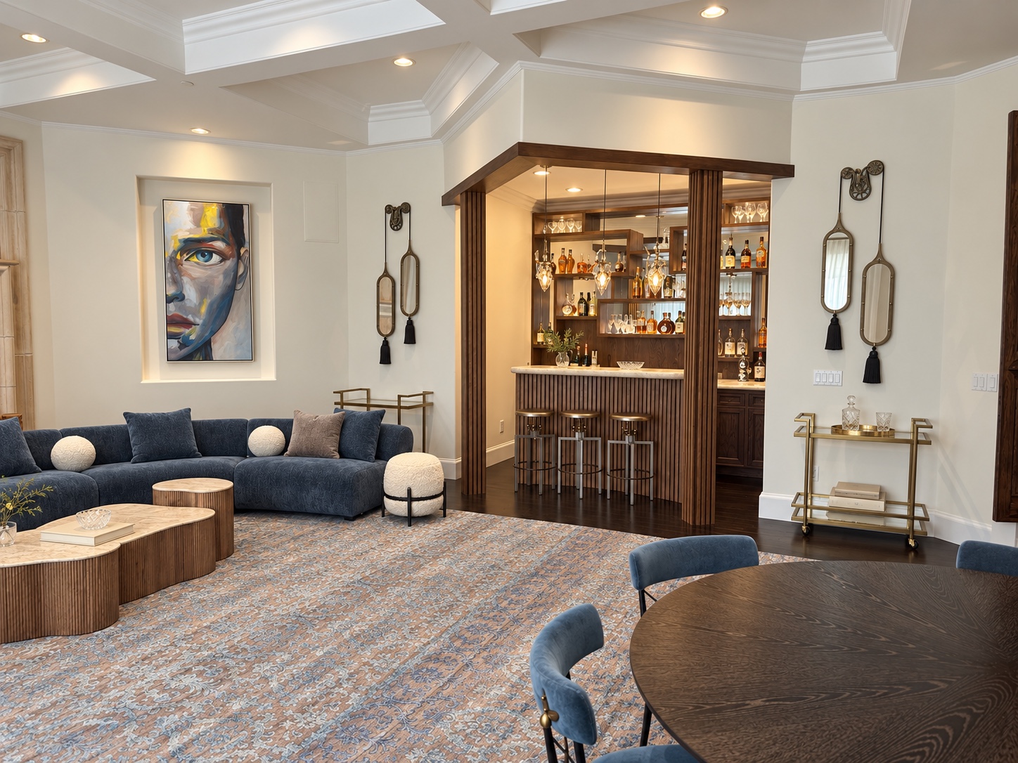 Entertainment lounge with blue seating, game table, and illuminated wood bar