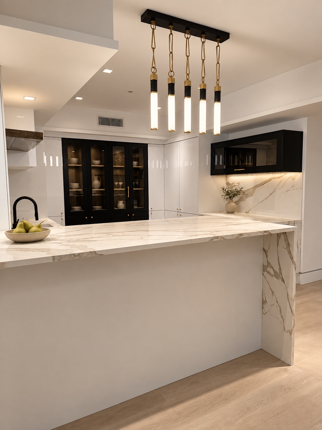 Basement kitchen with marble waterfall peninsula