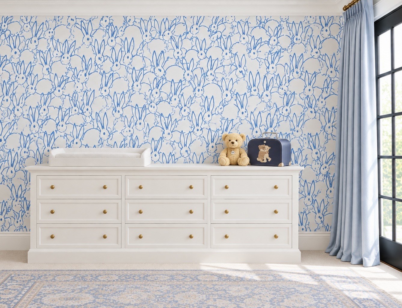 Bedroom dresser against blue patterned wallpaper