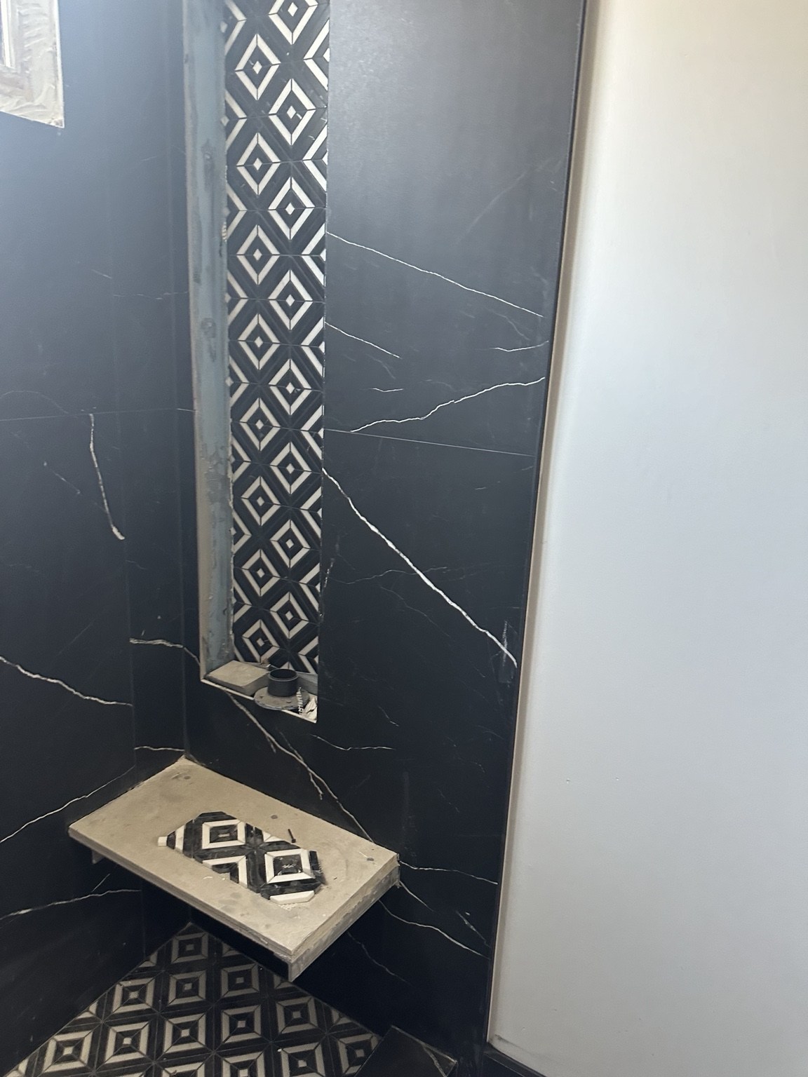 Shower niche and stone detailing during construction